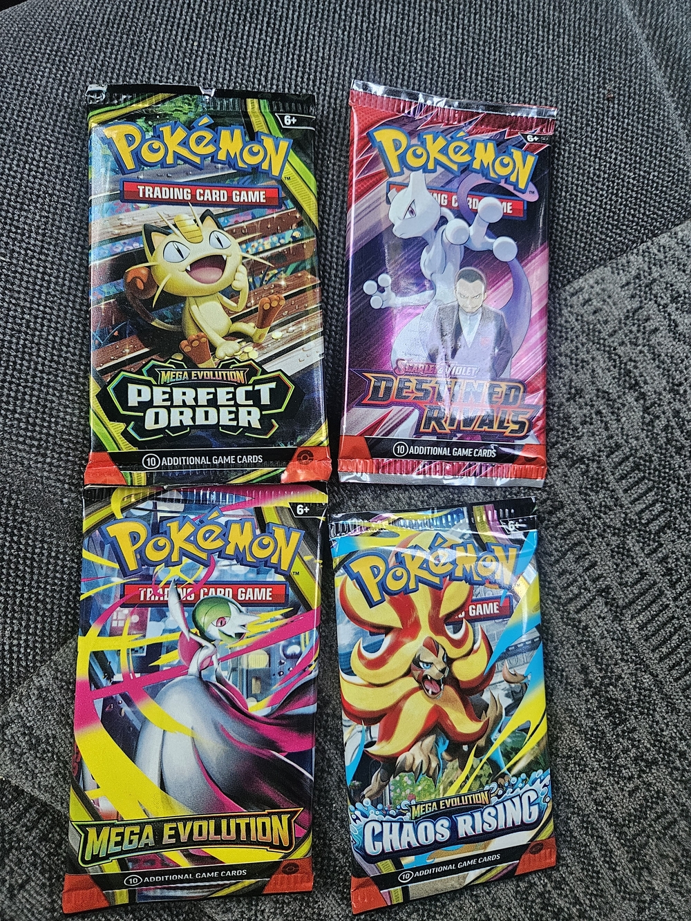 Pokemon Booster Pack Assortment - Black, Purple, Yellow, Blue